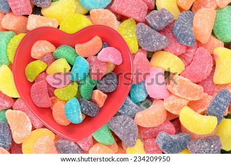 colorful gummy candy in heart shape bowl for Valentine Day