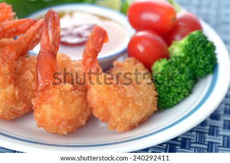 coconut shrimp with sauce and vegetable  in plate