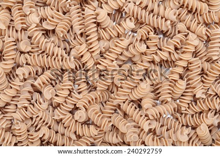 whole wheat pasta for background and texture