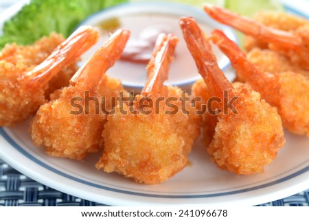 coconut shrimp with sauce and vegetable in plate