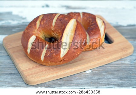 two pretzel ring bun on the table