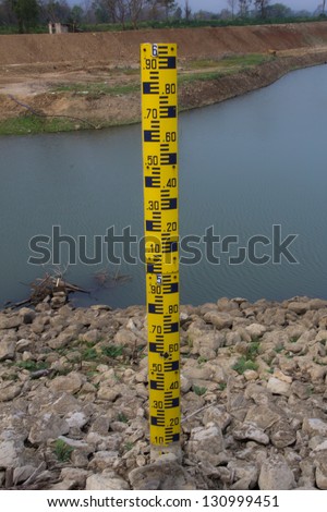 Measure the water level in the dam.