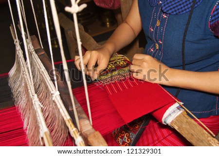 Ancient weaving cloth,Women weaving a cloth  in Chiang Mai