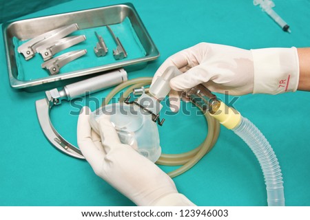 Set of tools for incubation tracheas with a hand of doctor connecting tube