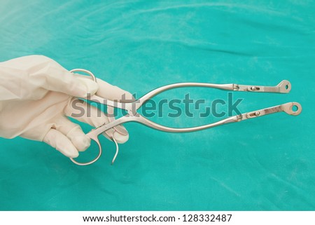 Medical scissors in hand of doctor