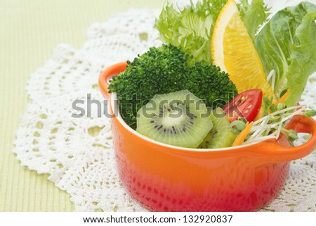 fusion food, fruit and vegetable salad in colorful cup