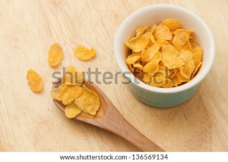 Corn flakes in wooden spoon