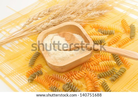 Wheat flour in wooden spoon on pasta and Spaghetti ,Grain And Cereal Products
