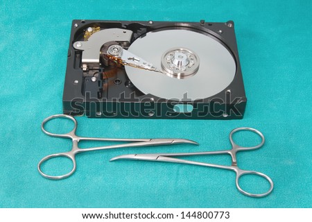 Hard drive with surgery tool ,Hard drive on repairs  data recovery concept