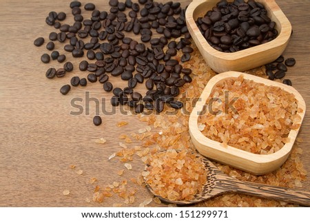 Organic rock candy sugar and coffee bean  in wooden bowl