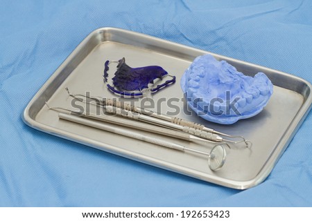 Dental gypsum models and dental brace (Retainer) in medical tray