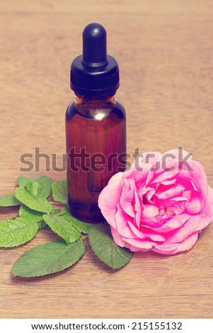 Rose essential oil in bottle, aroma oil use for spa and massage