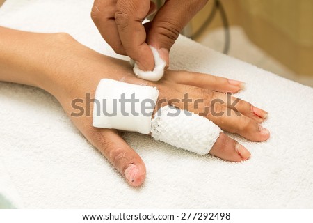 injured finger wrapped in a gauze bandage after surgery