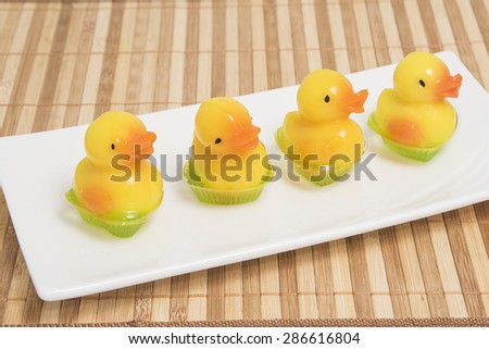 Coconut jelly yellow duck in white dish