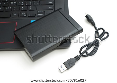 external hard disk connect to computer notebook on white.