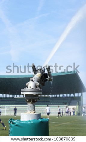 Automated sprinkler in a football stadium. Close up