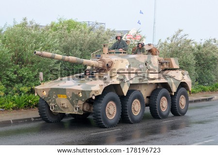 BLOEMFONTEIN, SOUTH AFRICA - February 2014: The Armed Forces parade the streets of Bloemfontein on February 21st, 2014 to commemorate World Armed Forces Day. Rooikat fighting vehicle drive by