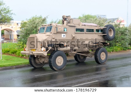 BLOEMFONTEIN, SOUTH AFRICA - February 2014: The Armed Forces parade the streets of Bloemfontein on February 21st, 2014 to commemorate World Armed Forces Day. Casspir MK3 Personnel Carrier drive by