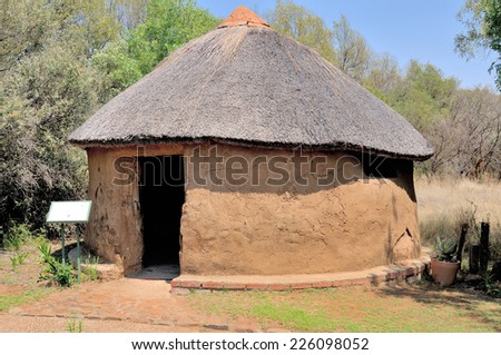 Traditional Sotho hut built by the indigenous Sotho tribe. Walls built from tree stumps covered with mud and dung. Roof thatched with a species of Hyparrhenia
