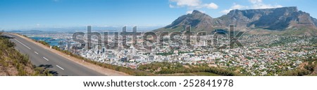 CAPE TOWN, SOUTH AFRICA - DECEMBER 18TH, 2014: Panorama of Table Mountain, Devils Peak, harbor and the city center as seen from Signal Hill.