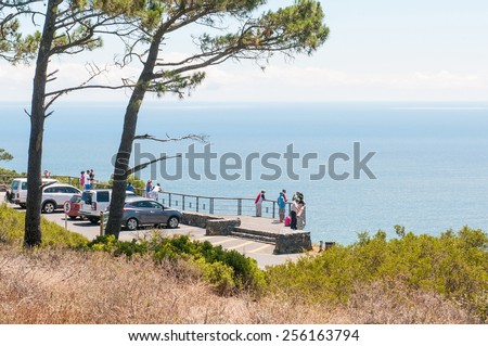 CAPE TOWN, SOUTH AFRICA - DECEMBER 18TH, 2014: Unidentified people at the viewpoint on Signal Hill. It offers a magnificent view of the city, Robben Island, Table Mountain, Lions Head and Devils Peak