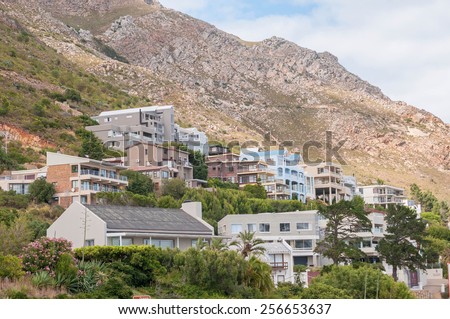 CAPE TOWN, SOUTH AFRICA - DECEMBER 20, 2014: Luxury homes against the Hottentots Holland Mountains in Gordons Bay near Cape Town.