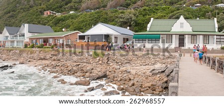 GEORGE, SOUTH AFRICA - JANUARY 3, 2015: Unidentified people, holiday homes and a caravan park at the beach at Victoria Bay