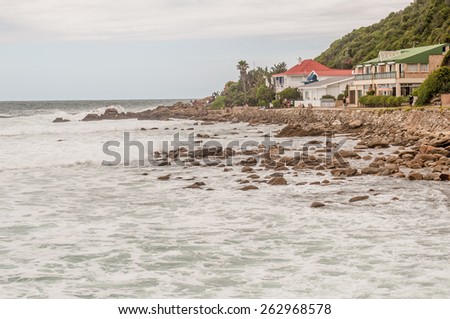 GEORGE, SOUTH AFRICA - JANUARY 3, 2015: Unidentified people in front of holiday homes at Victoria Bay
