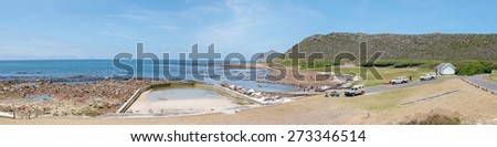 CAPE TOWN, SOUTH AFRICA - DECEMBER 12, 2014:  Beach scene at Bordjiesrif in the Cape Point section of the Table Mountain National Park. Cape Point is in the distance