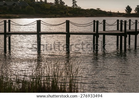 Silhouette of a jetty in a dam near Somerset West in the Western Cape Province of South Africa