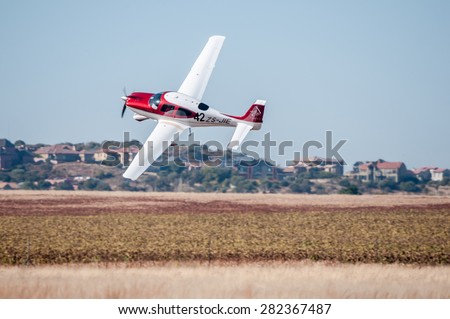 BLOEMFONTEIN, SOUTH AFRICA - MAY 29, 2015: Cirrus SR22 taking off. The 2015 Presidents Trophy Air Race was held at the Tempe Airport from 28 to 30 May 2015. More than 100 light aircraft participated