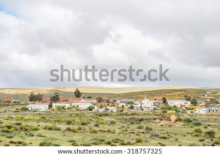 NUWERUS, SOUTH AFRICA - AUGUST 13, 2015: View of Nuwerus (new rest), a small town in the Western Cape Namaqualand. Fields of orange wild flowers are visible in the back
