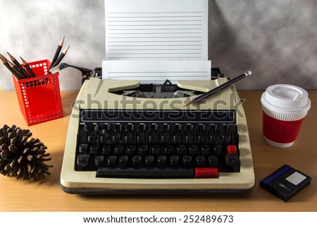 Typewriter with a coffee on work desk