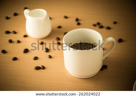 Coffee cup on wooden table Vintage Styled
