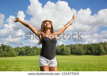 Cute African American woman hands in the air