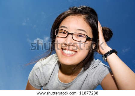 Asian girl having fun against the sky