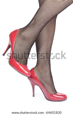 stock photo woman legs with fishnet stockings and heels over white 