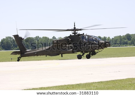 INDIANAPOLIS - JUNE 5: An Army  apache helicopter hovers in the air at the Indy air show at Mt. Comfort airport on June 5th, 2009 in Indianapolis,Indiana