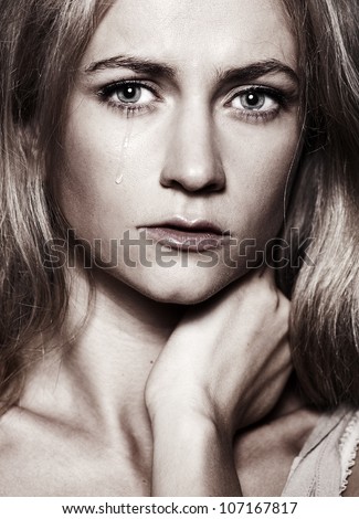 Sad woman with tears in her eyes