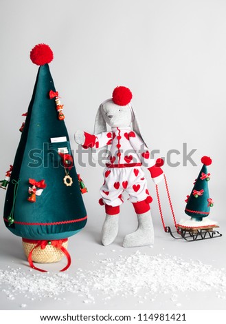 Hare dress up the tree. Christmas Card