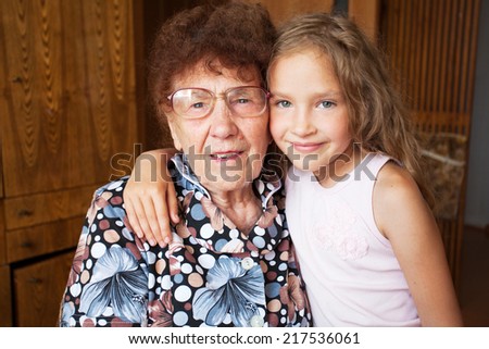 Senior with girl. Generation. Elderly woman with great-grandchild