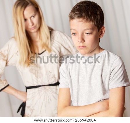 Mom swears by son. Conflict, problems in family. Sad mother and child