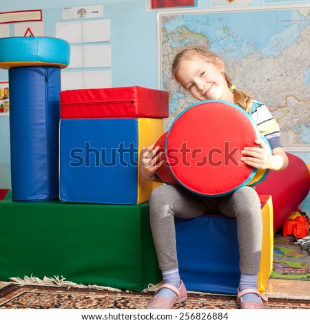 Children in kindergarten. Kids in nursery school. Girl playing box of bricks at infant school