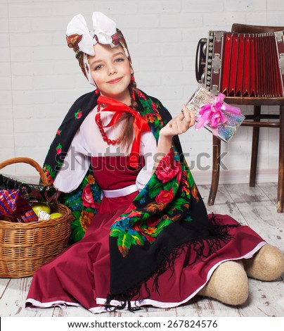 Russian girl in national dress. Child studio shot
