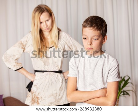 Mom swears by son. Conflict, problems in family. Sad mother and child