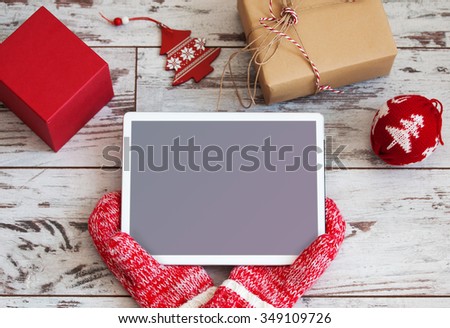 Tablet on Christmas background. New Year holiday