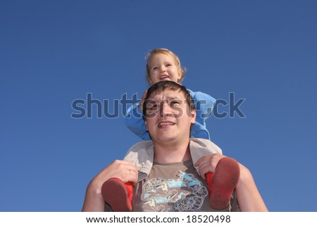 Happy the daddy with a daughter against the sky 4