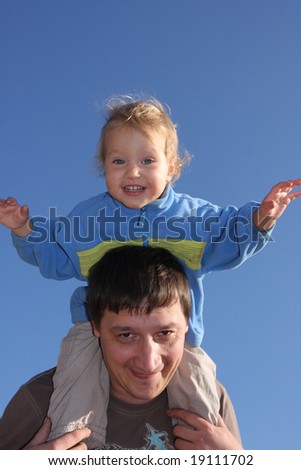 Happy the daddy with a daughter against the sky 2