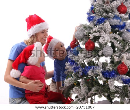 happy mother and children. stock photo : Happy mother and children over christmas tree