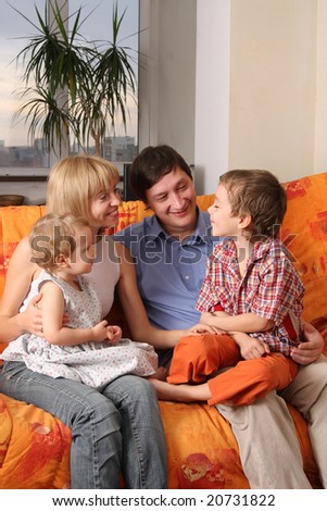 Happy family of the house on a sofa 3
